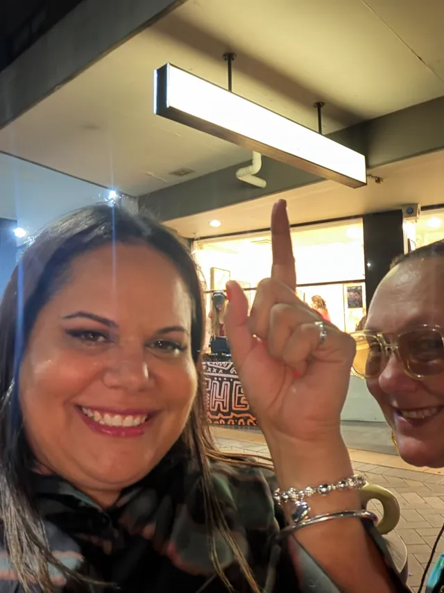 Two smiling guests outside the gallery on BLAK LUB opening night