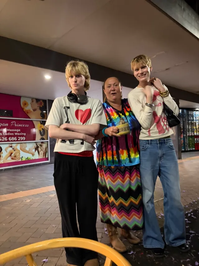 Three guests outside the gallery after BLAK LUB opening night